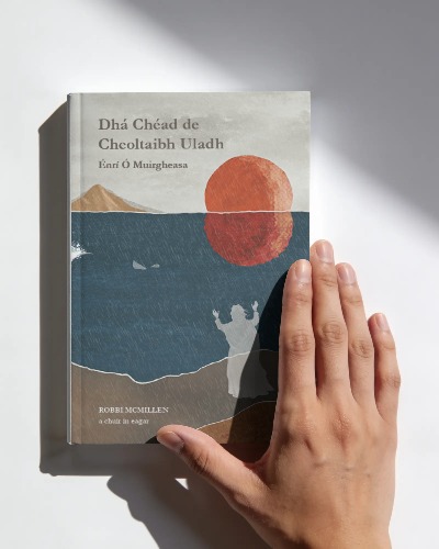 Hardback copy of Dhá Chéad de Cheoltaibh Uladh with hand over the cover